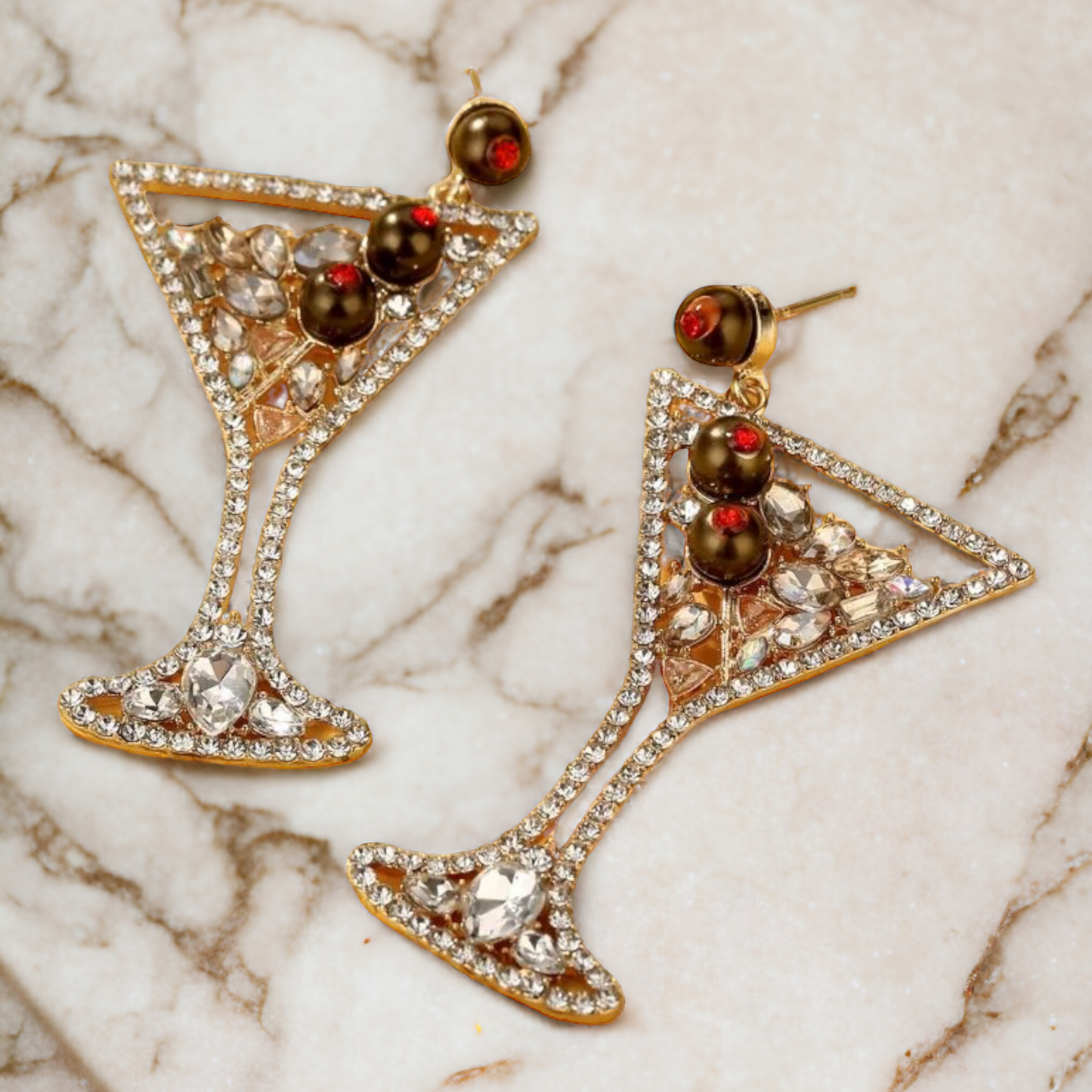 pair of earrings that look like the classy cocktail it mimics ,