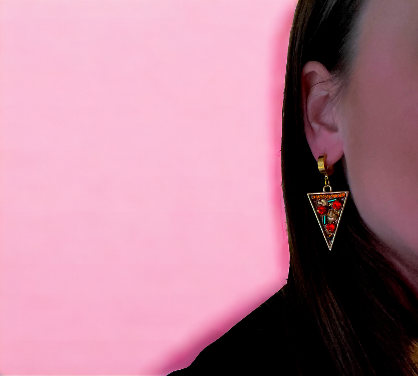 lifestyle photo of pizza party earrings shown on ear of model for scale