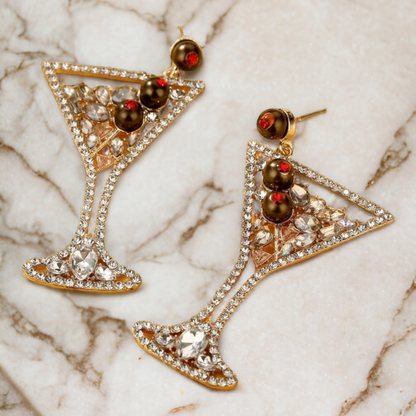 pair of earrings that look like the classy cocktail it mimics , 