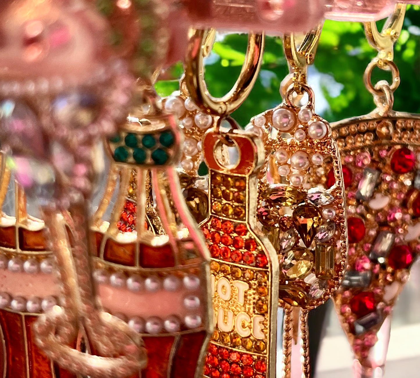 An earring holder that mimics a tiny coat rack , only cuter, with tiny hangers for all your earring styles from studs and hoops to drop and dangles.